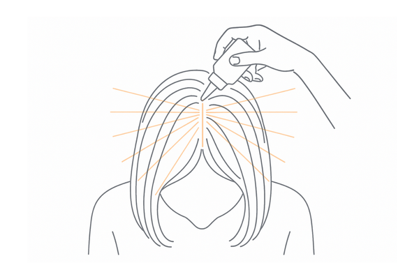 ノズルの先端を頭皮に当てて1cm間隔でライン塗布する正しい使い方（分け目）